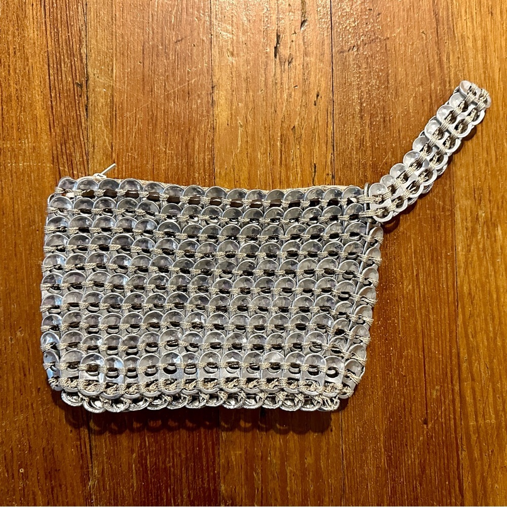 Pop top wristlet purse 8.5” x 4.5”, silver thread, perfect condition.